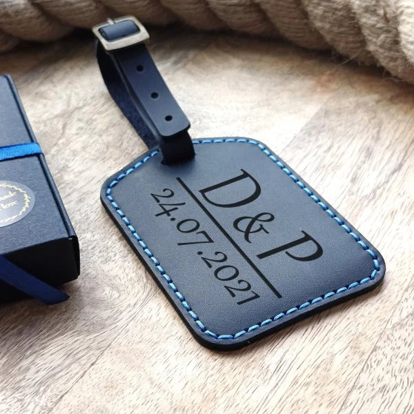 Personalized baggage tag handmade from full grain dark blue leather with engraving monogram, logo, name, initials, text and pictures etc