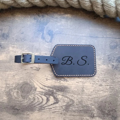 Custom personalized luggage tag handmade from brown leather with engraving monogram, logo, name, initials, phone number or text and pictures