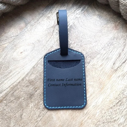 Personalized baggage tag handmade from full grain dark blue leather with engraving monogram, logo, name, initials, text and pictures etc