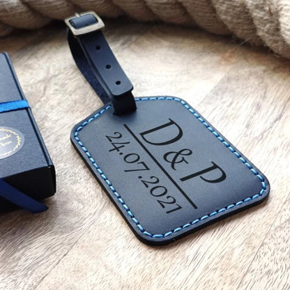 Personalized baggage tag handmade from full grain dark blue leather with engraving monogram, logo, name, initials, text and pictures etc