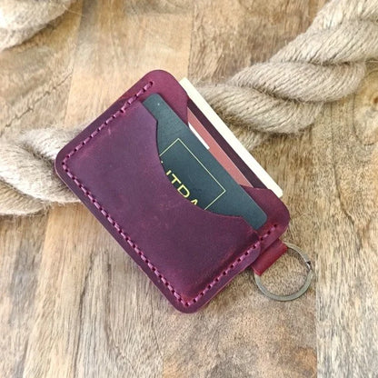 Personalized leather wallet with key ring. Slim, handmade wallet in burgundy leather with engraving of name, initials, etc.