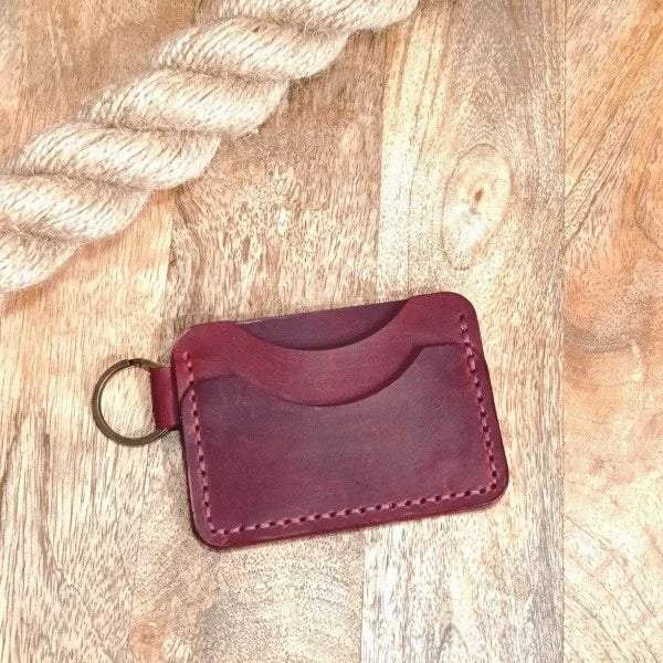 Personalized leather wallet with key ring. Slim, handmade wallet in burgundy leather with engraving of name, initials, etc.