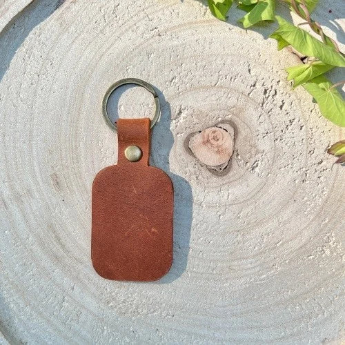 Keychain with wolf and personalized engraving of name, initials, memorable date, significant phrase handmade from high quality genuine leather